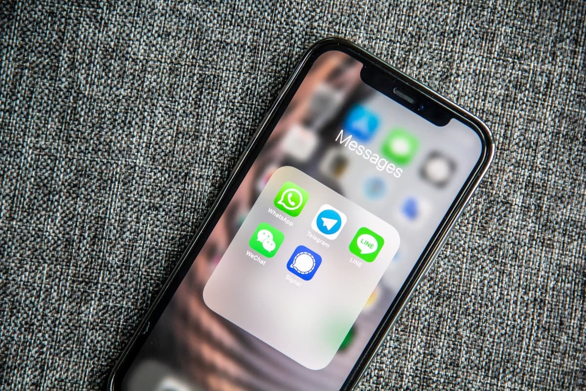 Messaging apps open on a phone screen